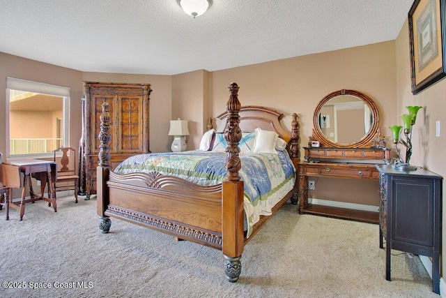 carpeted bedroom featuring a textured ceiling