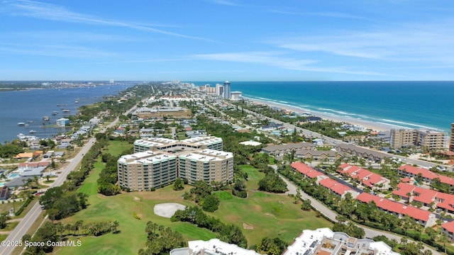 bird's eye view with a water view and view of golf course