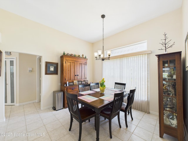 787 Carnation Dr, Sebastian, FL 32958 - dining space with baseboards, a notable chandelier, and light tile patterned floors