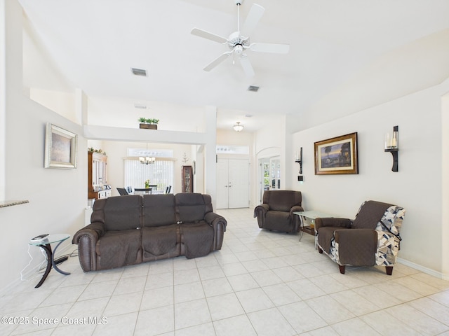 787 Carnation Dr, Sebastian, FL 32958 - living room featuring ceiling fan with notable chandelier, visible vents, high vaulted ceiling, and a healthy amount of sunlight