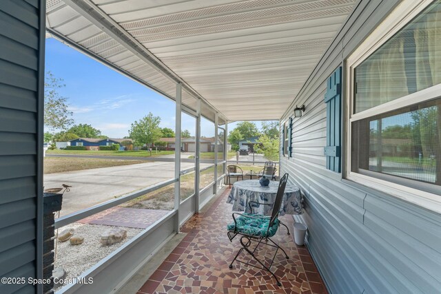 exterior space with a residential view and covered porch