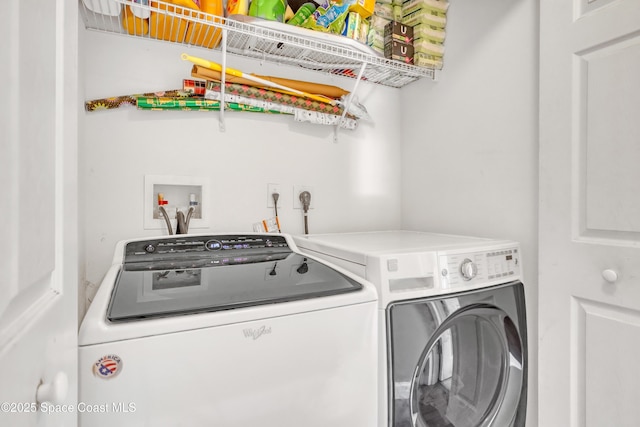 laundry room featuring washer and clothes dryer and laundry area