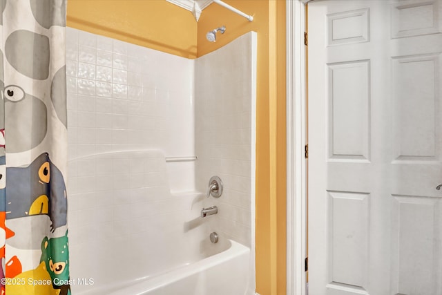bathroom featuring shower / bathtub combination with curtain