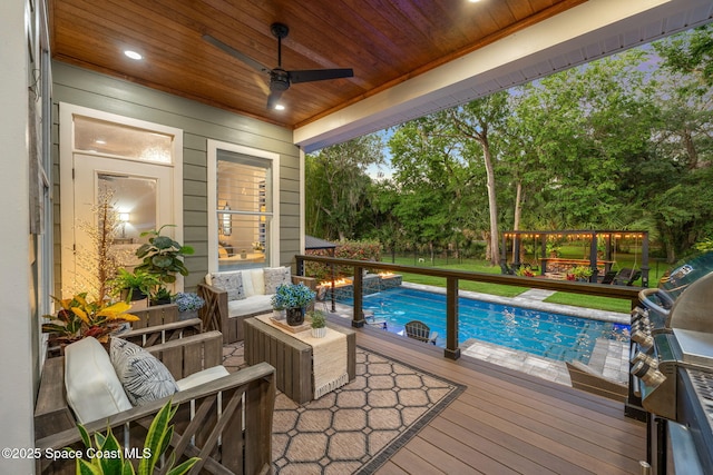 3592 S Park Ave, Titusville, FL 32780 - outdoor pool featuring a deck, a ceiling fan, and area for grilling