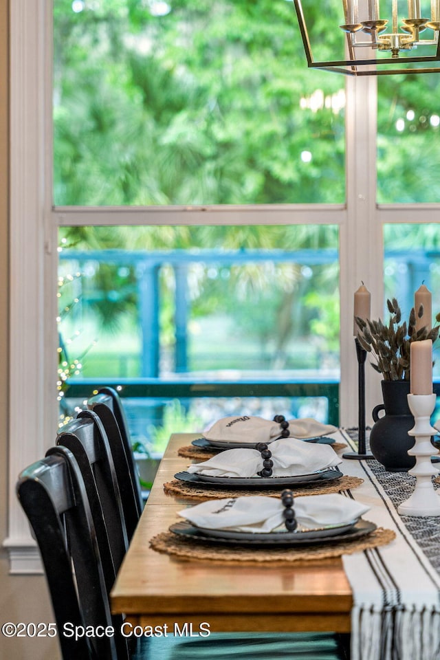 3592 S Park Ave, Titusville, FL 32780 - dining space featuring a chandelier