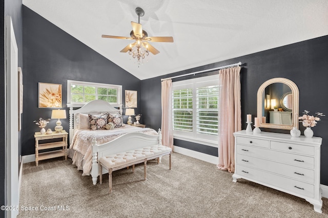 3592 S Park Ave, Titusville, FL 32780 - bedroom with lofted ceiling, carpet, multiple windows, baseboards, and ceiling fan