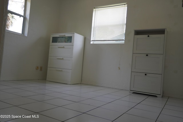spare room with light tile patterned floors
