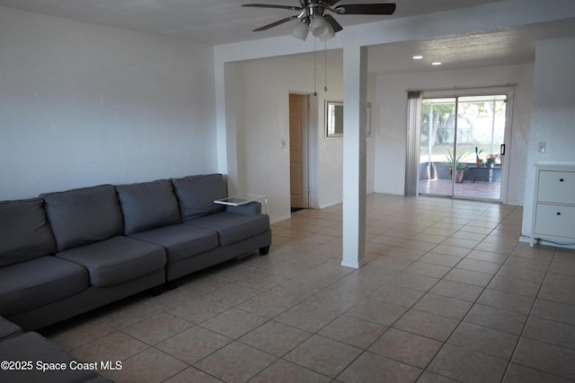 living area featuring recessed lighting, light tile patterned floors, and ceiling fan