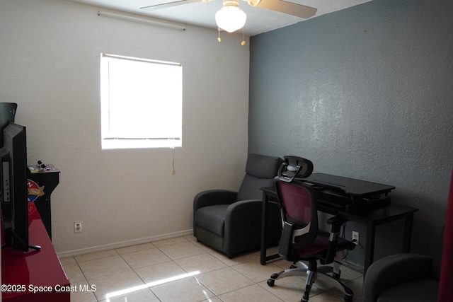home office with ceiling fan, tile patterned floors, and baseboards