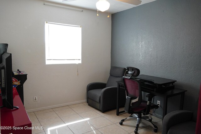 home office featuring tile patterned floors, baseboards, and a ceiling fan