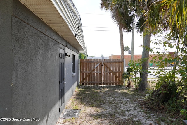 view of gate featuring fence