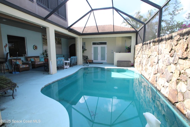 120 Edgewater Way, Merritt Island, FL 32953 - outdoor pool featuring french doors, a patio area, an outdoor living space, and a lanai
