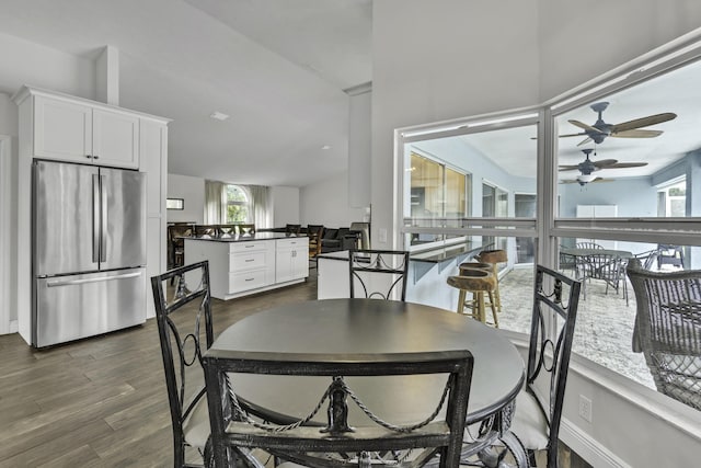 dining area featuring dark wood-style floors and ceiling fan