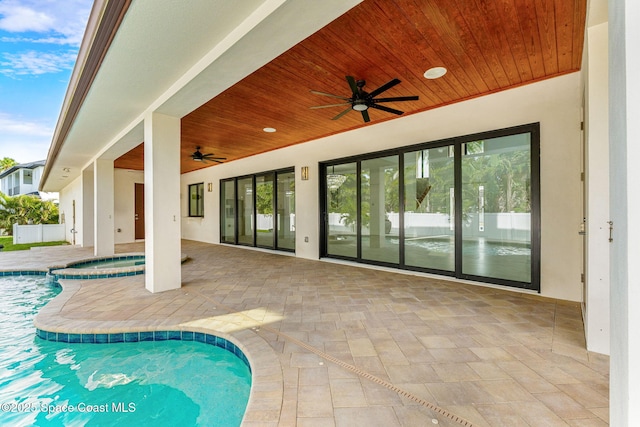 2355 N Riverside Dr, Indialantic, FL 32903 - outdoor pool featuring a patio, ceiling fan, an in ground hot tub, and fence