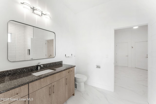 2355 N Riverside Dr, Indialantic, FL 32903 - bathroom with vanity, marble finish floor, baseboards, and toilet