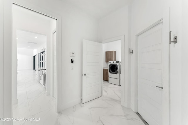 2355 N Riverside Dr, Indialantic, FL 32903 - hall with baseboards, washing machine and dryer, recessed lighting, and marble finish floor