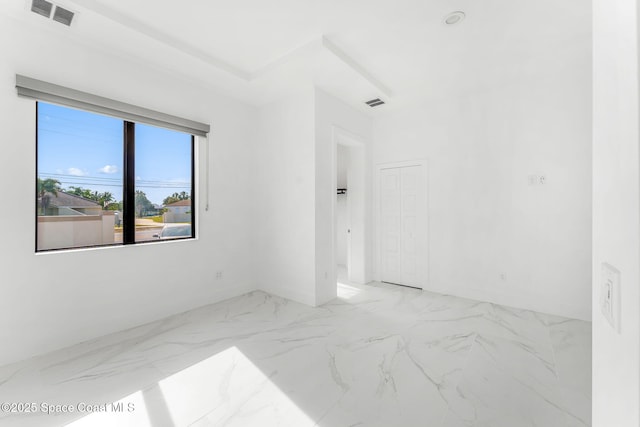 2355 N Riverside Dr, Indialantic, FL 32903 - unfurnished room with baseboards, visible vents, and marble finish floor