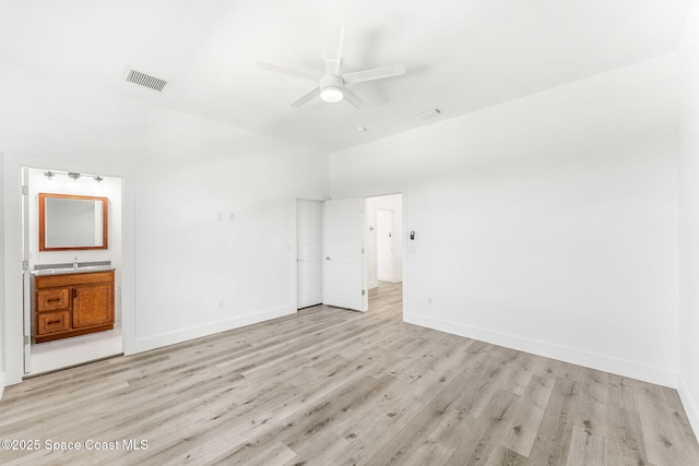 2355 N Riverside Dr, Indialantic, FL 32903 - unfurnished bedroom featuring baseboards, visible vents, light wood-style flooring, and ensuite bath