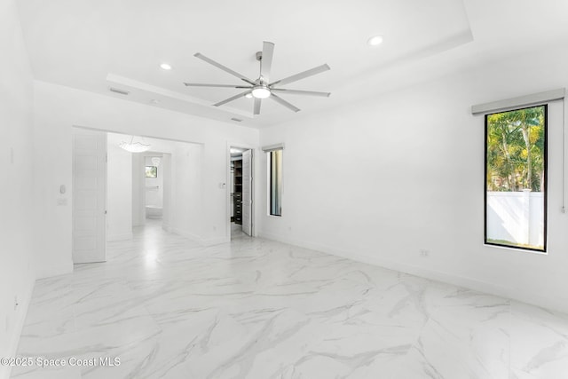 2355 N Riverside Dr, Indialantic, FL 32903 - unfurnished room with baseboards, a ceiling fan, a tray ceiling, and recessed lighting