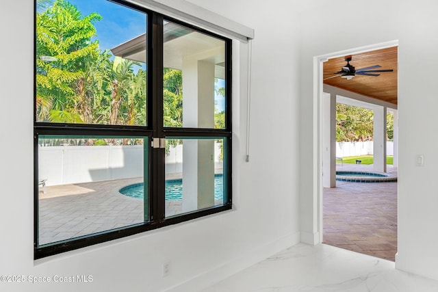 2355 N Riverside Dr, Indialantic, FL 32903 - doorway featuring baseboards, a ceiling fan, and a wealth of natural light