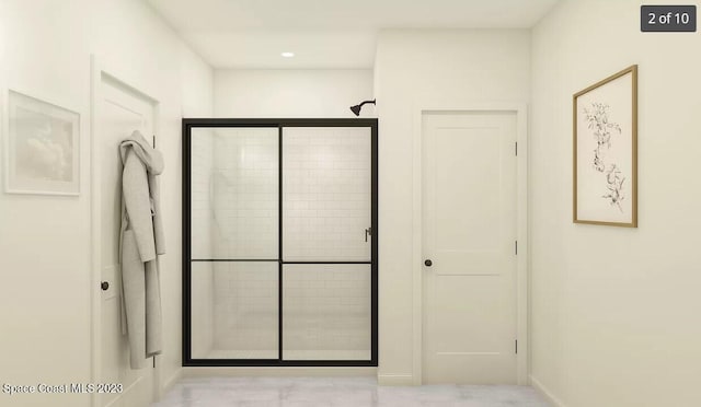 full bathroom featuring recessed lighting and a stall shower