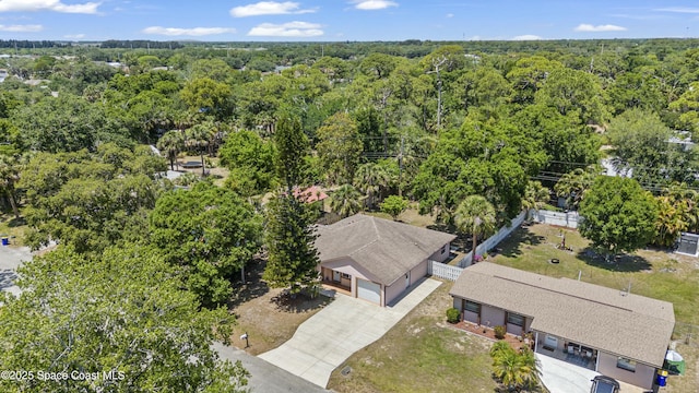 1044 Bernice Rd, Rockledge, FL 32955 - drone / aerial view featuring a view of trees
