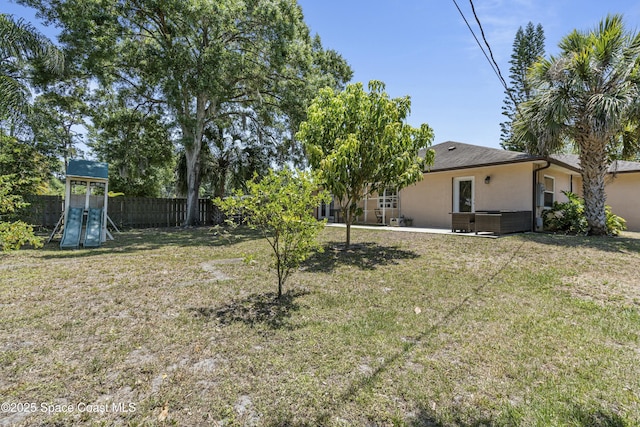 1044 Bernice Rd, Rockledge, FL 32955 - view of yard featuring a playground and fence