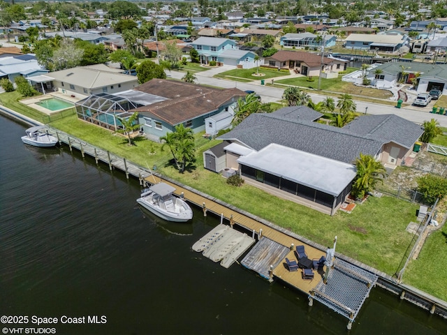 aerial view featuring a residential view and a water view