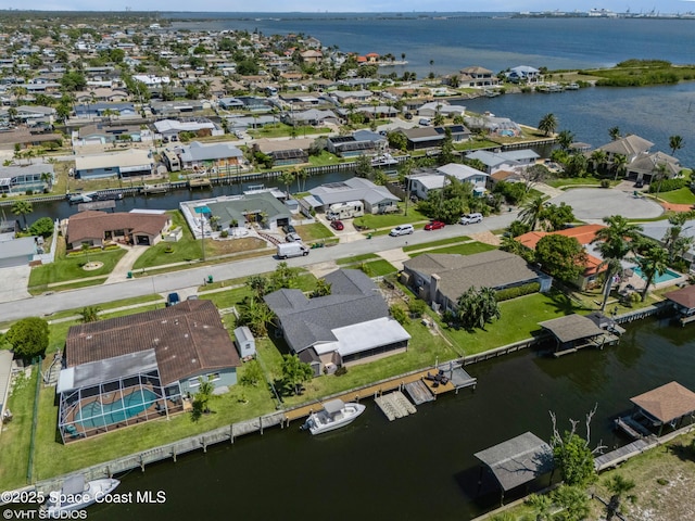 aerial view with a residential view and a water view