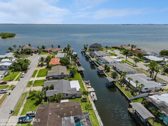 birds eye view of property featuring a residential view and a water view