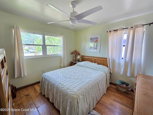 305 Harrison Ave, Cape Canaveral, FL 32920 - bedroom featuring wood-type flooring and a ceiling fan