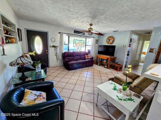 305 Harrison Ave, Cape Canaveral, FL 32920 - living room featuring light tile patterned floors and ceiling fan