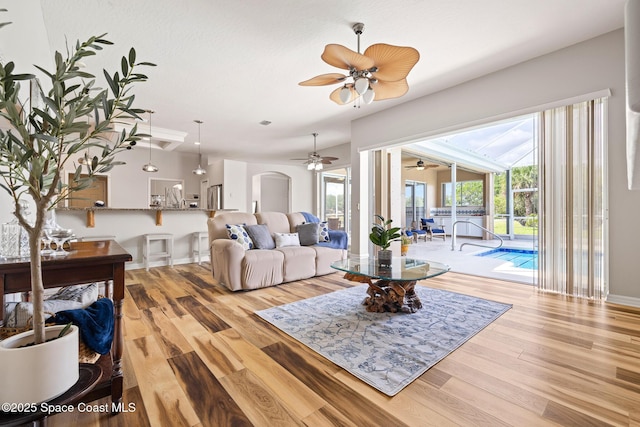 4800 Solitary Dr, Rockledge, FL 32955 - living area featuring wood finished floors, ceiling fan, a sunroom, and baseboards
