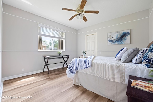 4800 Solitary Dr, Rockledge, FL 32955 - bedroom with wood finished floors, a closet, a ceiling fan, and baseboards