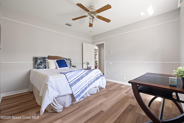 4800 Solitary Dr, Rockledge, FL 32955 - bedroom with baseboards, visible vents, ceiling fan, and light wood-type flooring