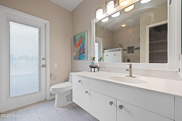 4800 Solitary Dr, Rockledge, FL 32955 - full bath with toilet, tile patterned floors, vanity, and a tile shower