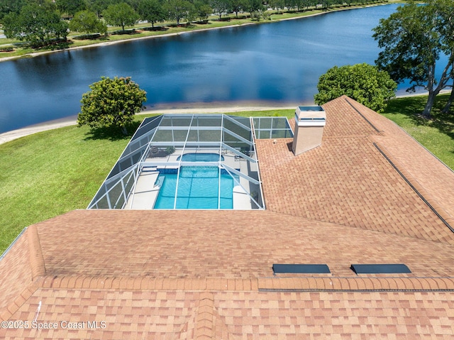 4800 Solitary Dr, Rockledge, FL 32955 - view of pool featuring a yard, a water view, glass enclosure, a pool with connected hot tub, and a patio area