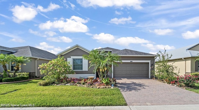 3624 Sansome Cir, Melbourne, FL 32940 - single story home featuring stucco siding, an attached garage, decorative driveway, and a front lawn