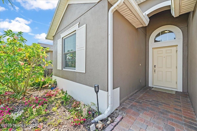 3624 Sansome Cir, Melbourne, FL 32940 - property entrance with stucco siding