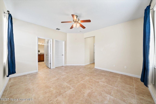 3624 Sansome Cir, Melbourne, FL 32940 - unfurnished bedroom with baseboards, ensuite bathroom, and ceiling fan