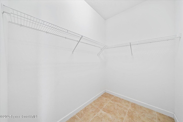 3624 Sansome Cir, Melbourne, FL 32940 - walk in closet featuring light tile patterned flooring