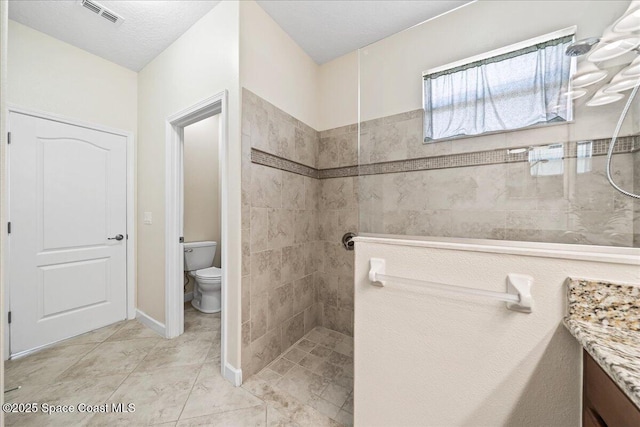 3624 Sansome Cir, Melbourne, FL 32940 - bathroom with a walk in shower, toilet, and vanity