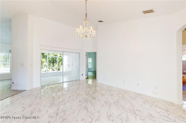 115 Briarcliff Cir, Sebastian, FL 32958 - empty room featuring visible vents, a notable chandelier, and a healthy amount of sunlight