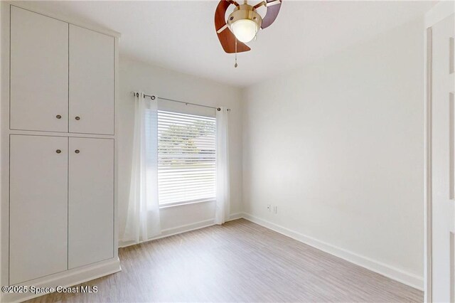 115 Briarcliff Cir, Sebastian, FL 32958 - unfurnished bedroom with a ceiling fan, baseboards, a closet, and light wood-type flooring