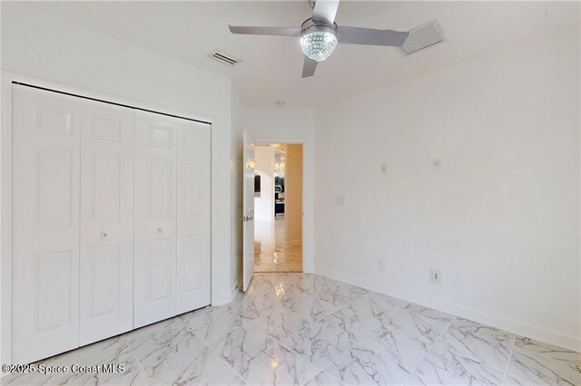 115 Briarcliff Cir, Sebastian, FL 32958 - unfurnished bedroom featuring ceiling fan, visible vents, baseboards, a closet, and marble finish floor