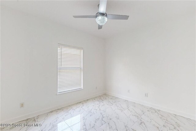 115 Briarcliff Cir, Sebastian, FL 32958 - unfurnished room featuring baseboards, ceiling fan, and marble finish floor