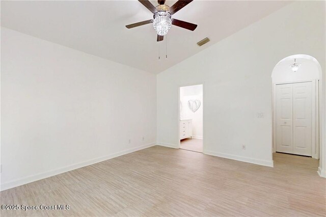 115 Briarcliff Cir, Sebastian, FL 32958 - unfurnished room featuring arched walkways, high vaulted ceiling, a ceiling fan, baseboards, and visible vents