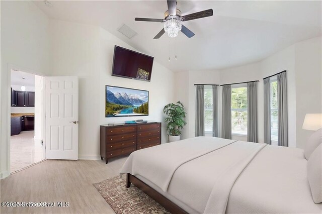 115 Briarcliff Cir, Sebastian, FL 32958 - bedroom with a ceiling fan, baseboards, lofted ceiling, and light wood finished floors