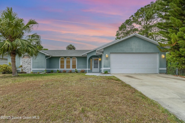 1318 Camas Ave NW, Palm Bay, FL 32907 - single story home featuring an attached garage, stucco siding, a yard, and concrete driveway