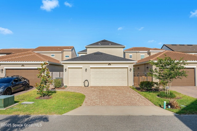8048 Gullen Dr, Melbourne, FL 32940 - view of front of home featuring an attached garage, stucco siding, driveway, and fence